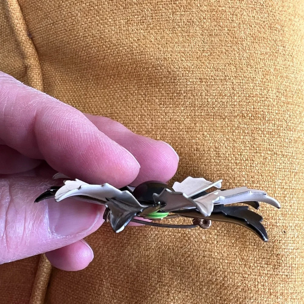 Vintage floral brooch black&white enamel petals and solid black center.